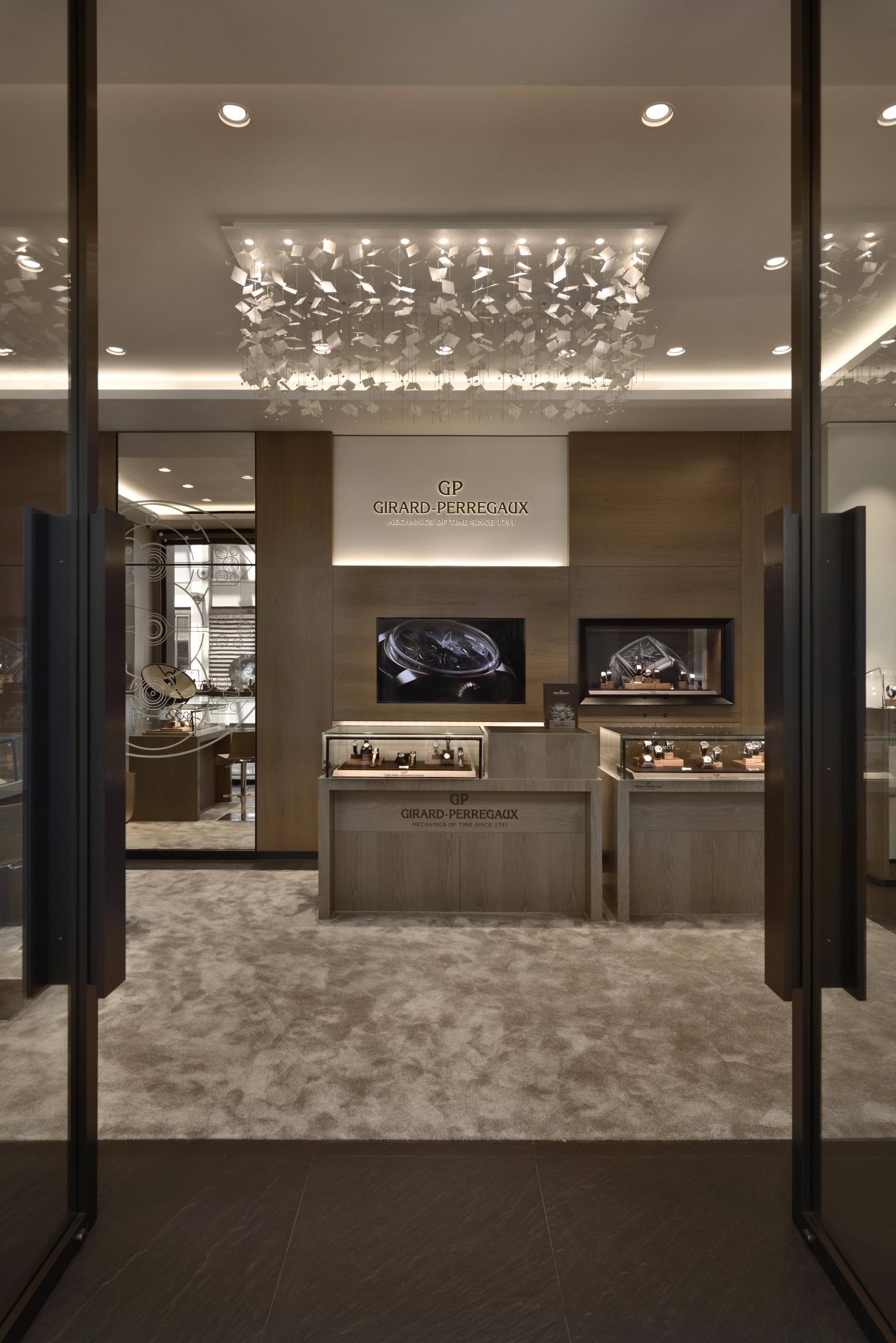 Girard-Perregaux Hour Glass Singapore Aerial lights chandelier piece adds height and dramatic touch to the boutique